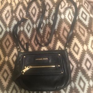 Michael Kors purse and Big Buddha.